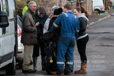 Pictured: Prince Charles speaks to residents in Ballater amongst the devistation in the wake of Storm Frank (Photo: Ross Johnston/Newsline Media)
