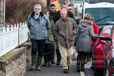 Pictured: Prince Charles speaks to Rev. David Barr in Ballater about the flooding (Photo: Ross Johnston/Newsline Media)